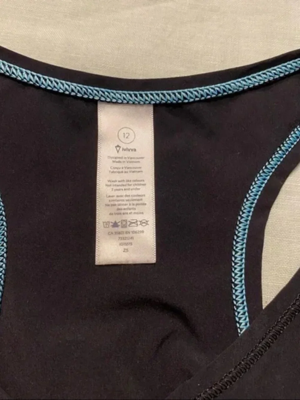 Ivivva black racerback v-neck laser cut Set Motion tank top